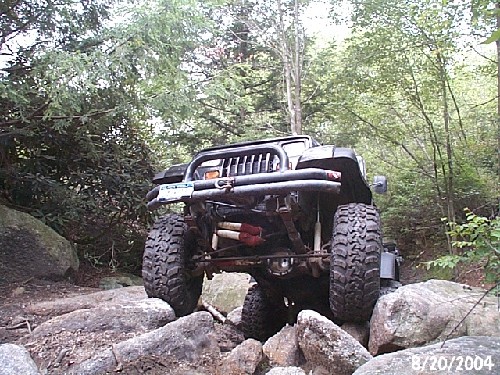 Black Jeep Wrangler overcoming rocks, Long Island Off Road