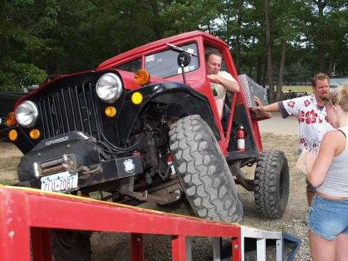Man driving custom Jeep on ramp