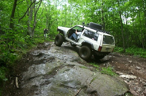 Off-road Jeep navigating rocky terrain