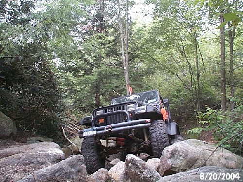 Jeep navigating rocky terrain