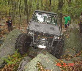 Off-road vehicle navigating rocks; Long Island Off Road