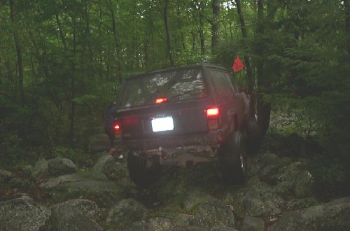 Jeep traversing rocky terrain