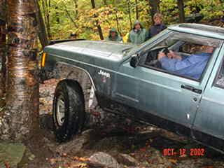 Man driving Jeep on rocky trail
