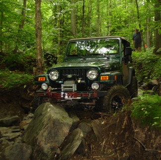 Jeep traversing rocky trail