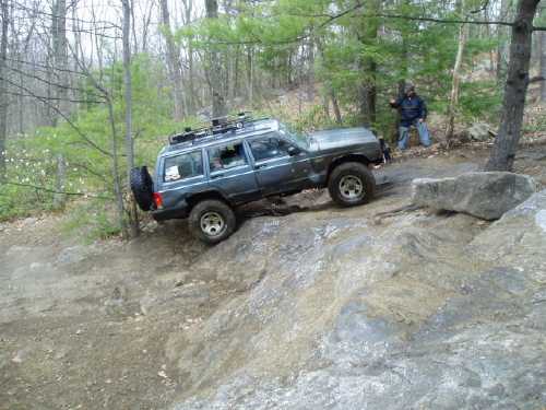 Jeep navigating rocky terrain