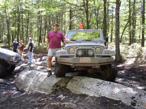 Man standing by gray Jeep Wrangler, Long Island Off Road