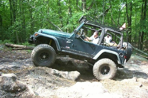 Jeep navigating rocky terrain