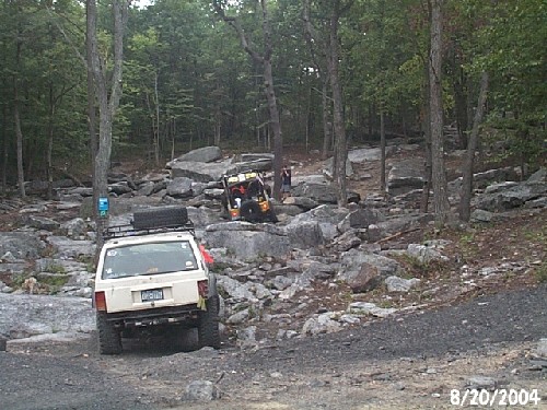 Off-road vehicles navigating rocky terrain
