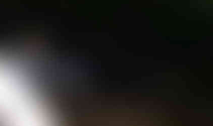 Man checks jeep's tire during night off-roading