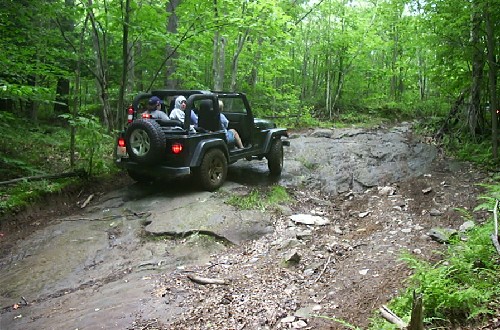 Jeep traversing rocky trail, Long Island Off Road
