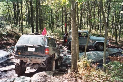 Jeeps navigating rocky Carnage Hill trail