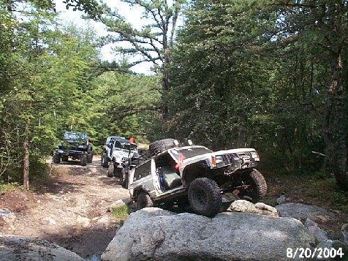 Off-road vehicles navigating rocky terrain