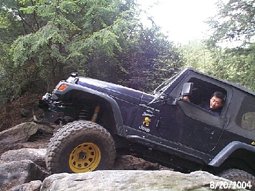 Jeep navigating rocky terrain
