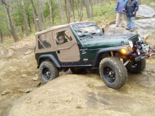 Jeep navigating rocky terrain