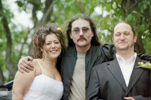 Wedding photo: bride with two men