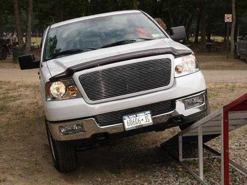 White Ford pickup truck on ramp