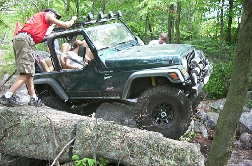 Jeep navigating rocks; off-road adventure