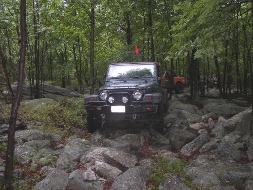 Jeep navigating rocky terrain