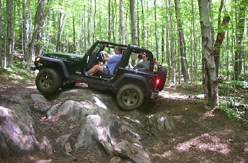 Jeep traversing rocky terrain