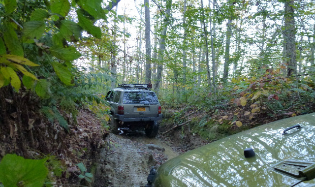 SUV navigating muddy trail, Long Island Off Road