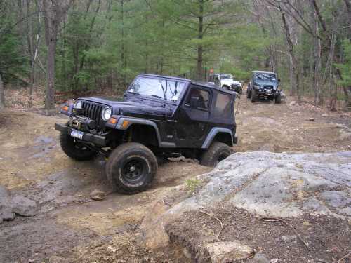 Jeep traversing rocky terrain