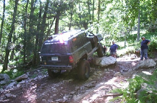 Black Jeep overcoming rocks, Long Island Off Road