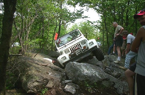 White Jeep navigating rocks, Long Island Off Road