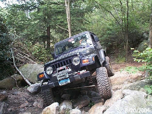 Jeep traversing rocky terrain