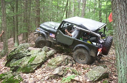 Jeep traversing rocky trail