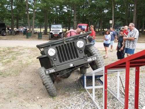 Man driving vintage Jeep, Long Island Off Road