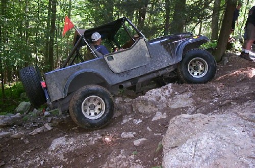 Jeep navigating rocky terrain