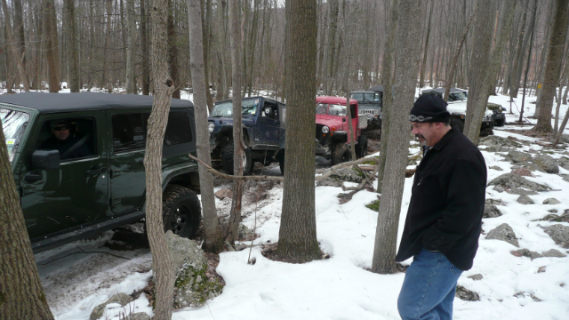Jeeps stuck in snowy woods
