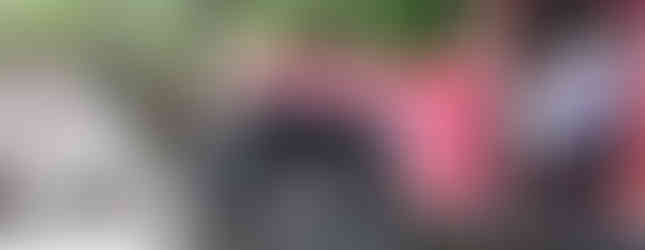 Red Jeep navigating rocky trail