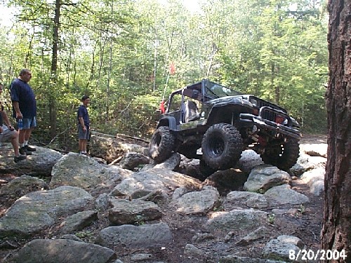 Jeep navigating rocky terrain