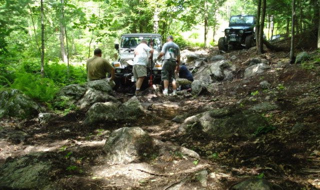 Jeepers working on rocky trail