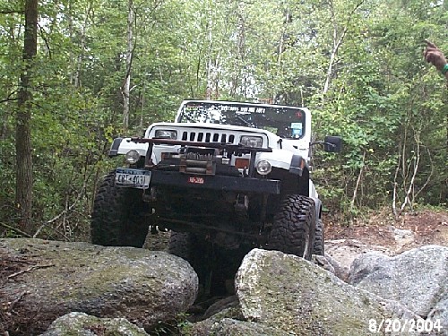 White Jeep Wrangler conquers rocks; Long Island Off Road