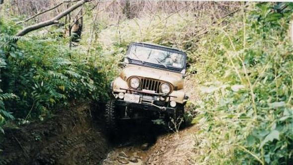 Jeep navigating muddy trail