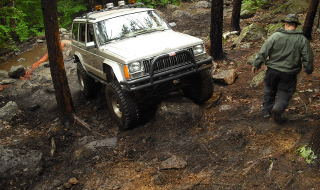 Off-road Jeep navigating rocky terrain