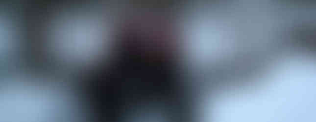 Red Jeep navigating snowy trail