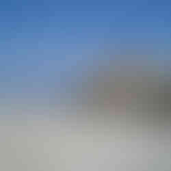 Family explores coastal rock formation