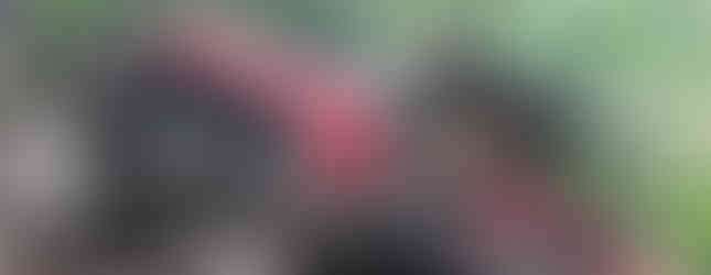 Man driving red Jeep on rocky trail