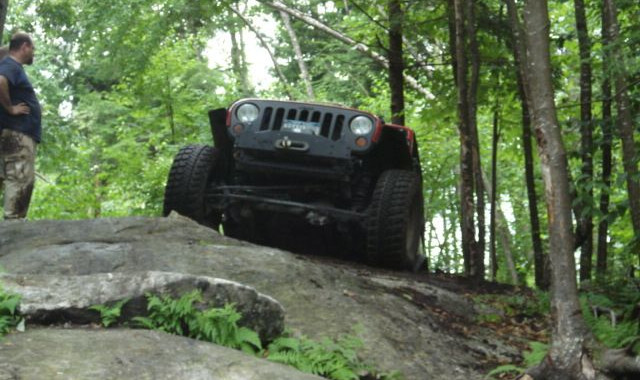 Jeep ascending rocky trail