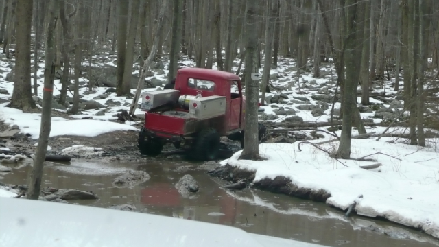 Red truck stuck in mud at Rausch Creek