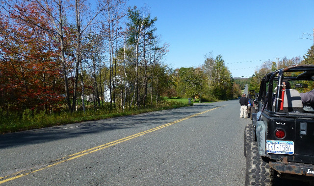 Jeep parked on Long Island road, autumn foliage