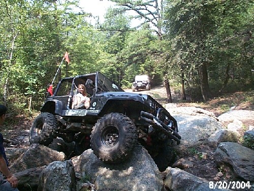 Black Jeep navigating rocky trail