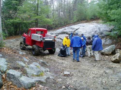 Volunteers cleaning near red truck