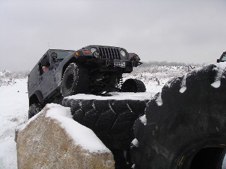 Jeep navigating snowy obstacle course
