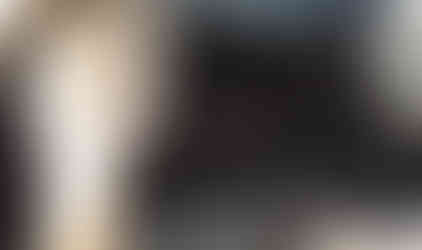 Person inspecting off-road vehicle's undercarriage