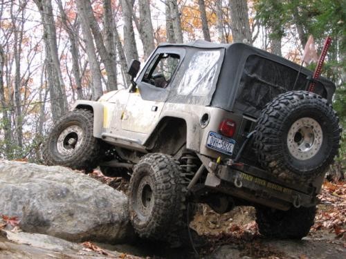 Modified Jeep navigating rocks