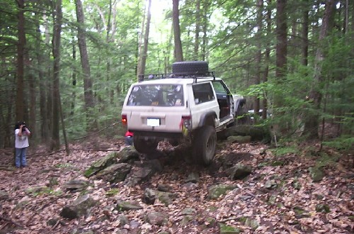 White Jeep Cherokee off-roading